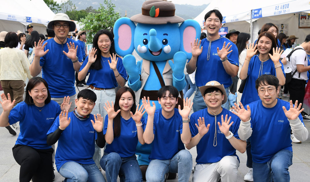 People taking a commemorative picture during the Blue Elephant activity