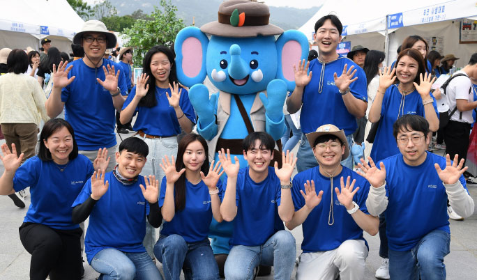 People taking a commemorative picture during the Blue Elephant activity